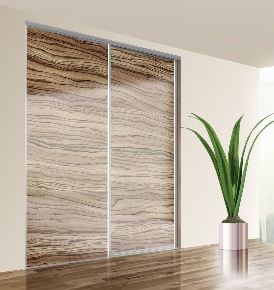 A stunning wooden large internal sliding door with silver detailing.